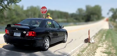 holding car at stop sign