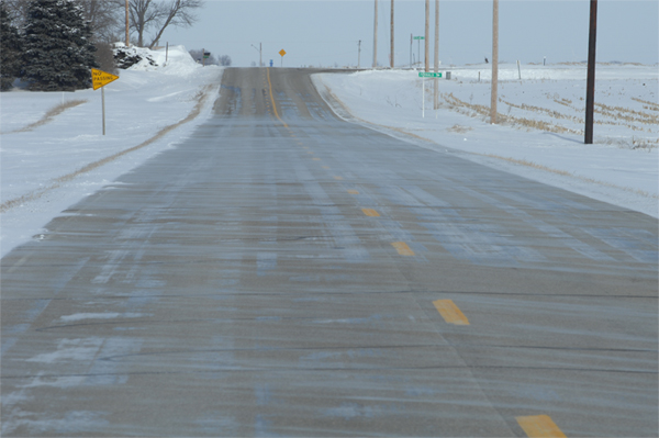 Wheel-track glazing on county road S27, near Fernald.