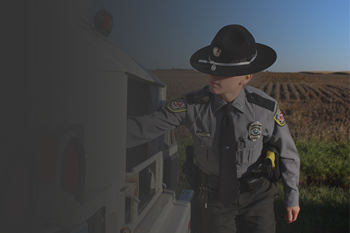 photo of enforcement officer talking to trick driver